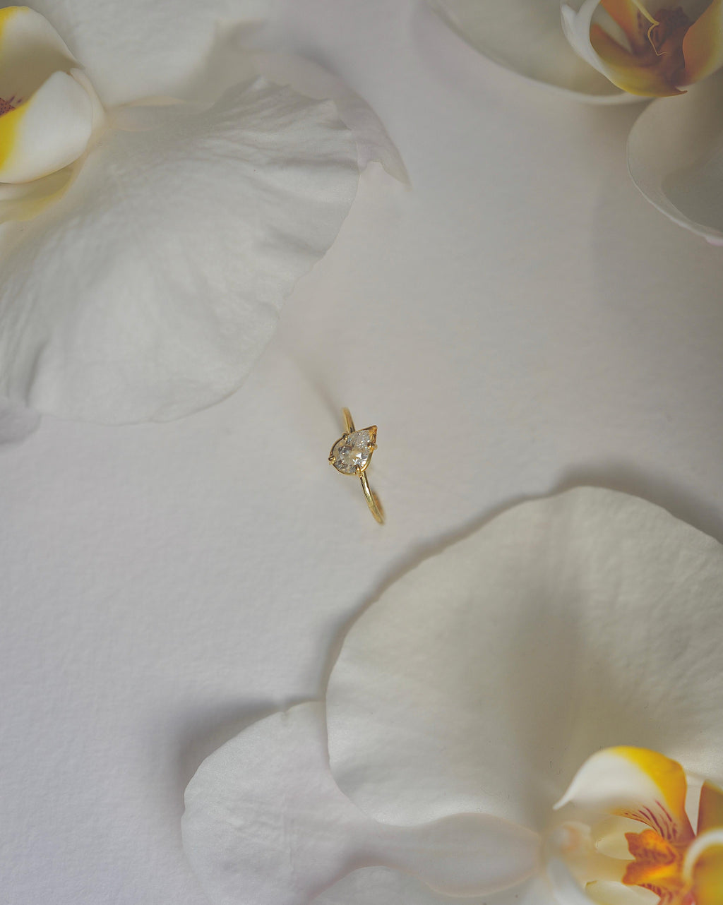 tilted pear diamond ring