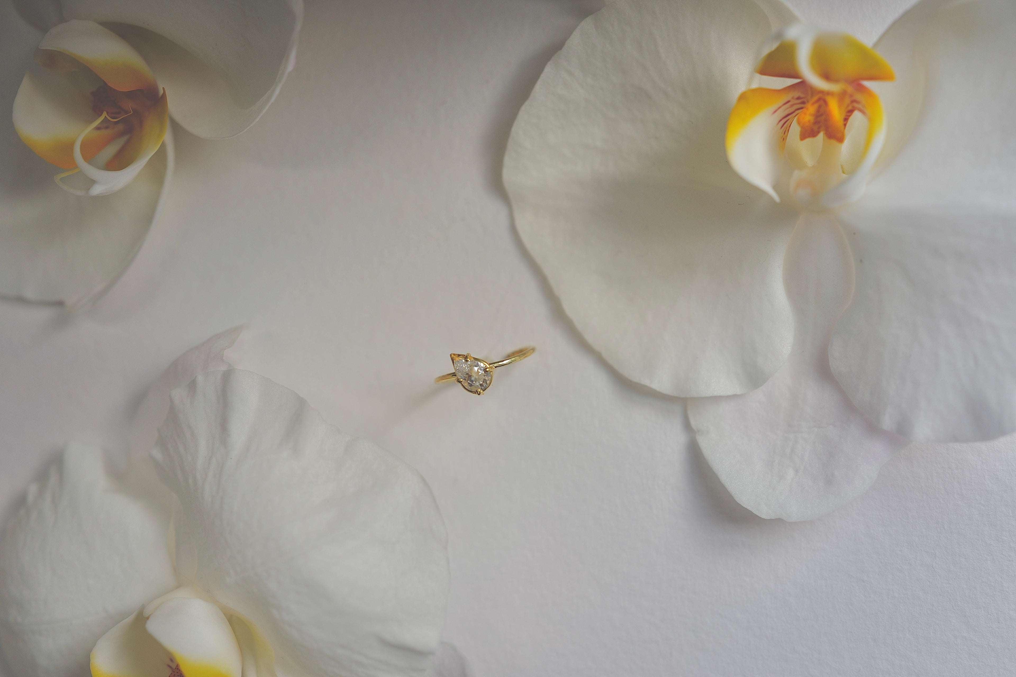 tilted pear diamond ring