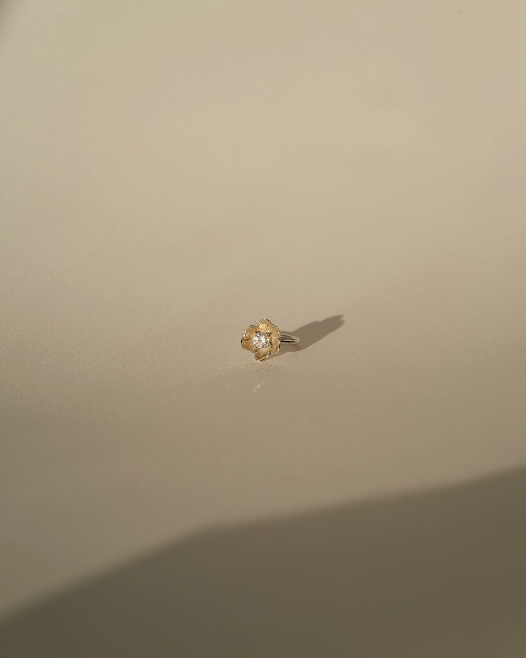 a diamond poppy ring