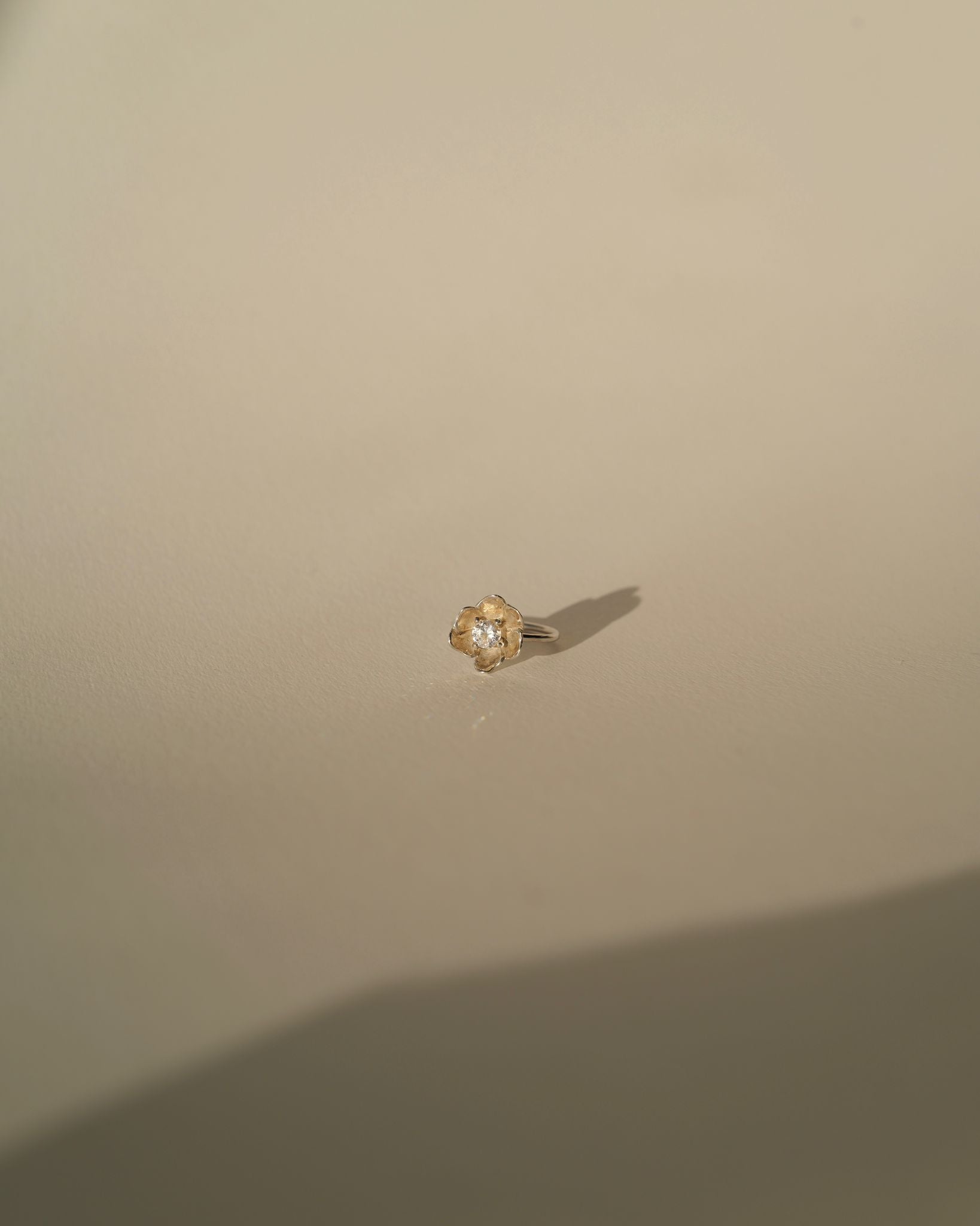 a diamond poppy ring