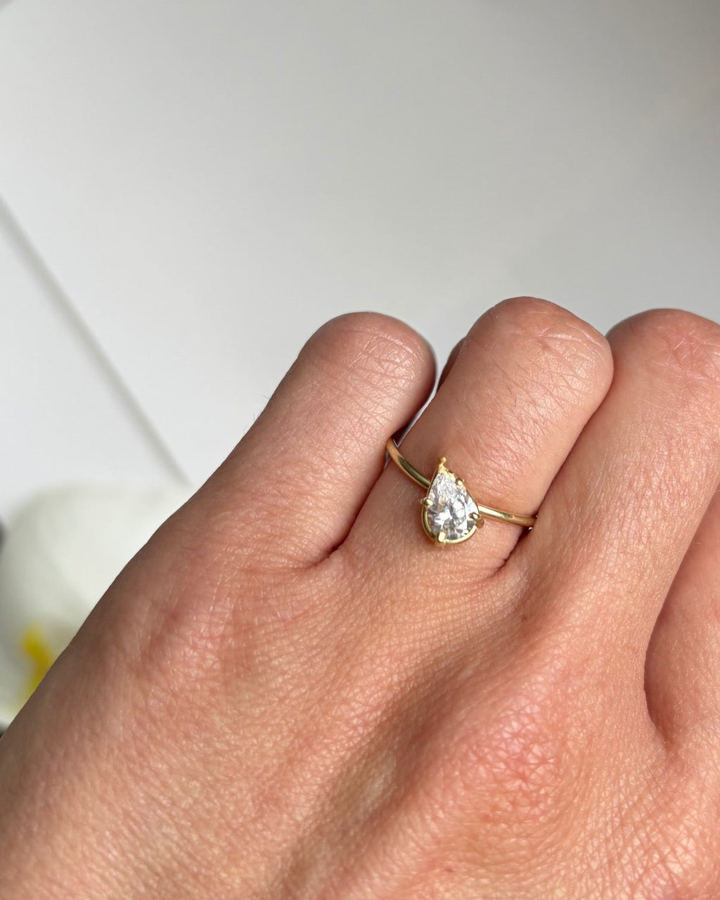 tilted pear diamond ring