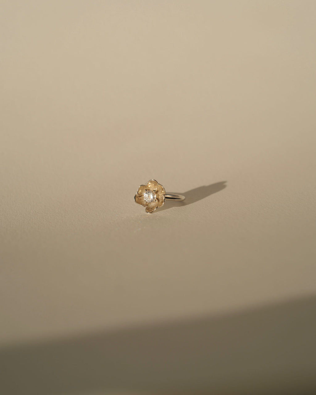 a diamond poppy ring