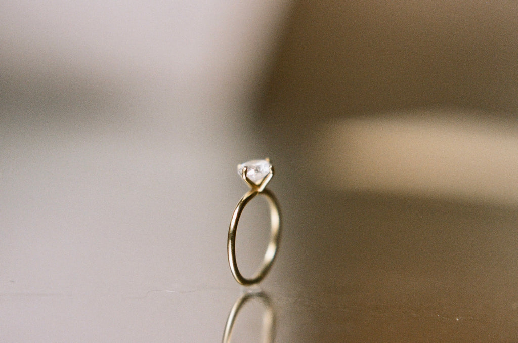 east-west claw-set diamond ring