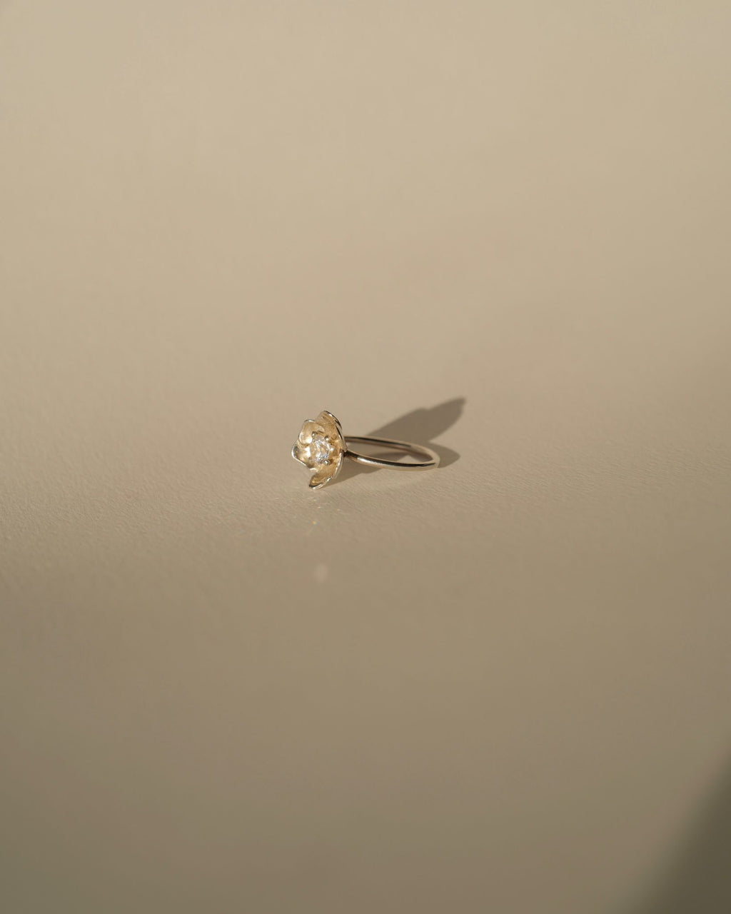 a diamond poppy ring