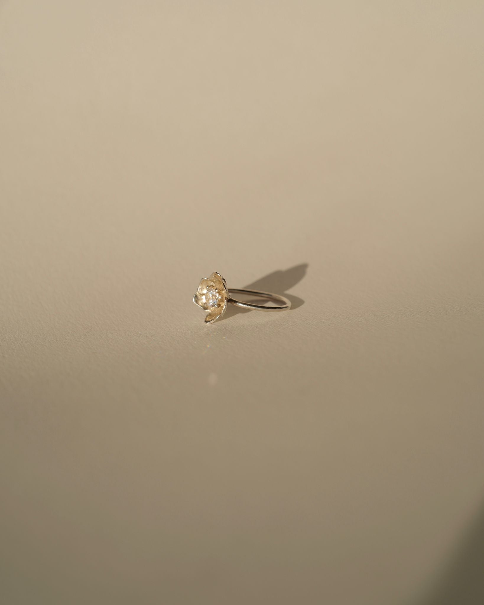 a diamond poppy ring