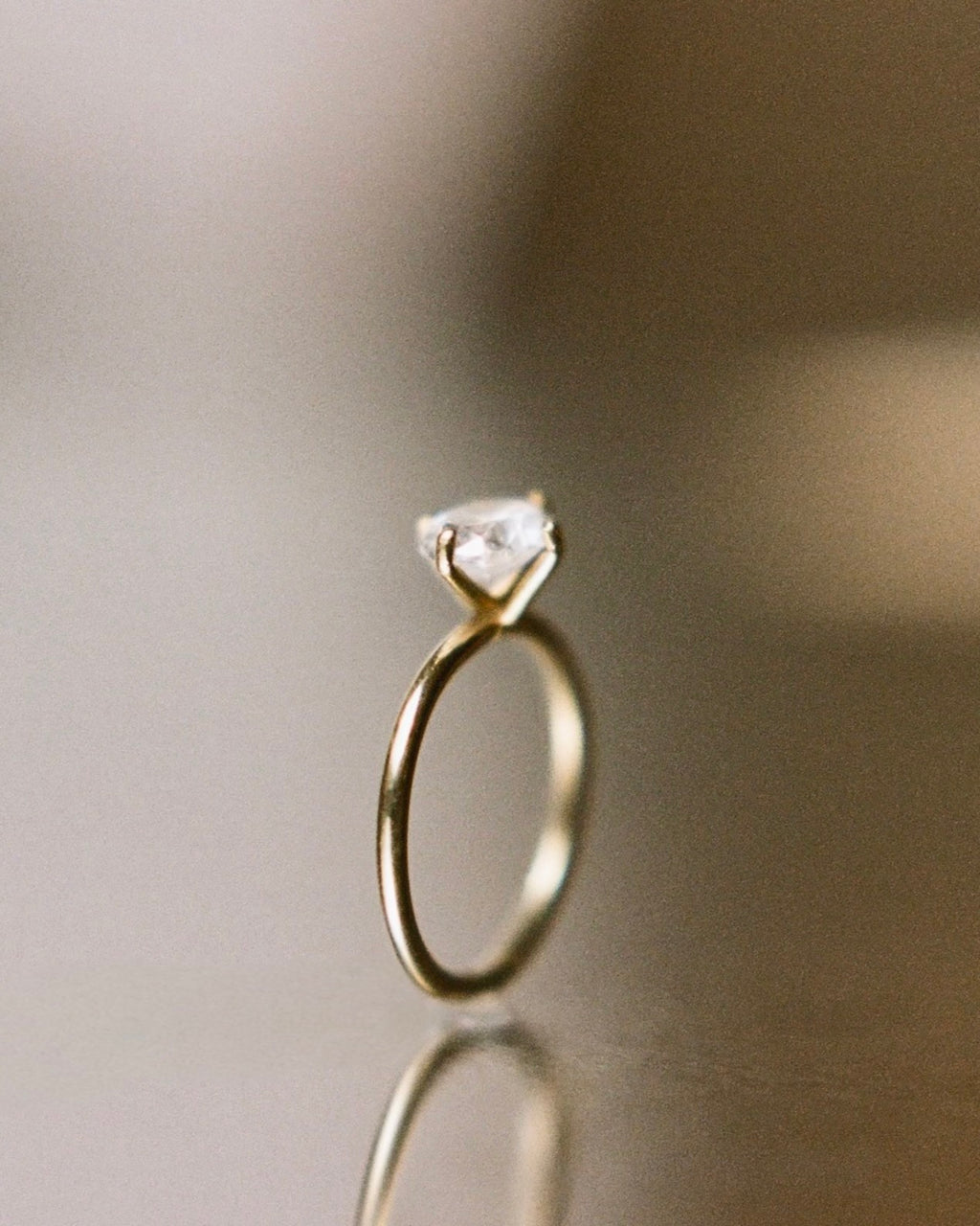 east-west claw-set diamond ring