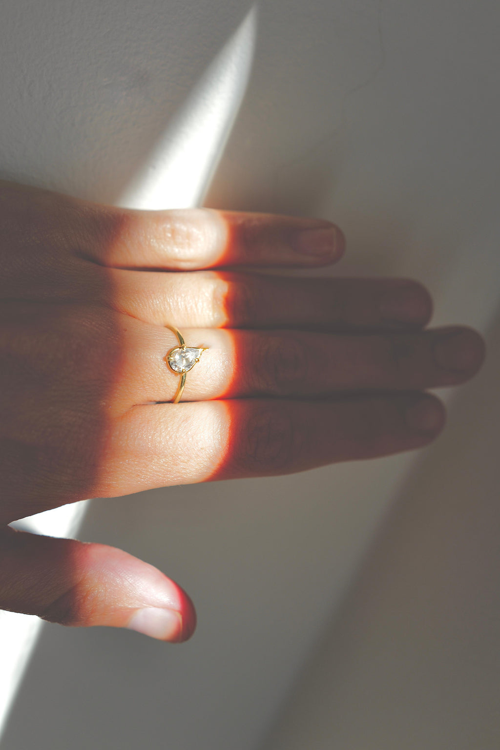 tilted pear diamond ring