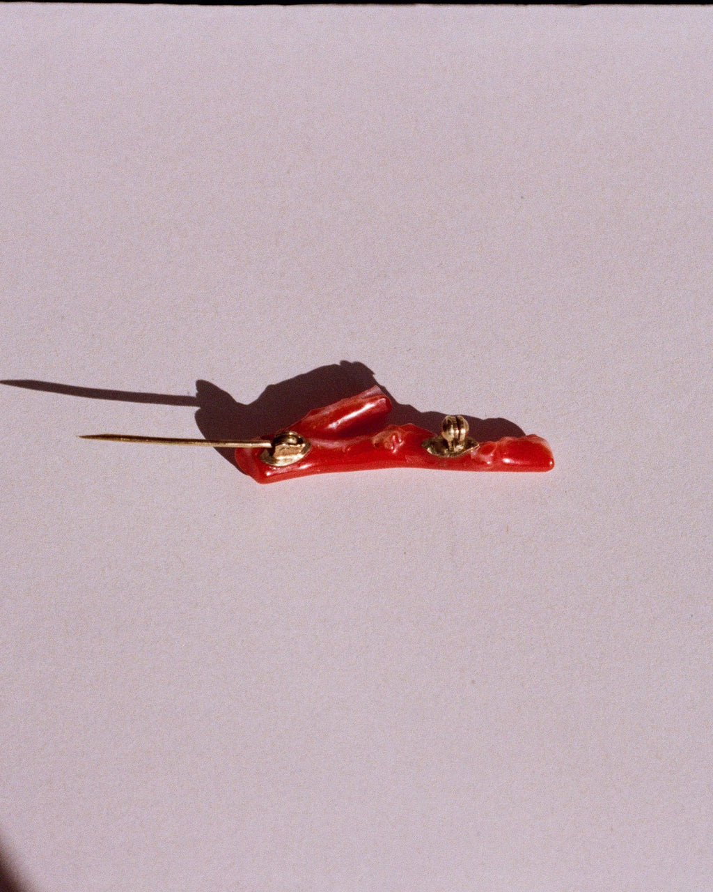 coral and gold brooch