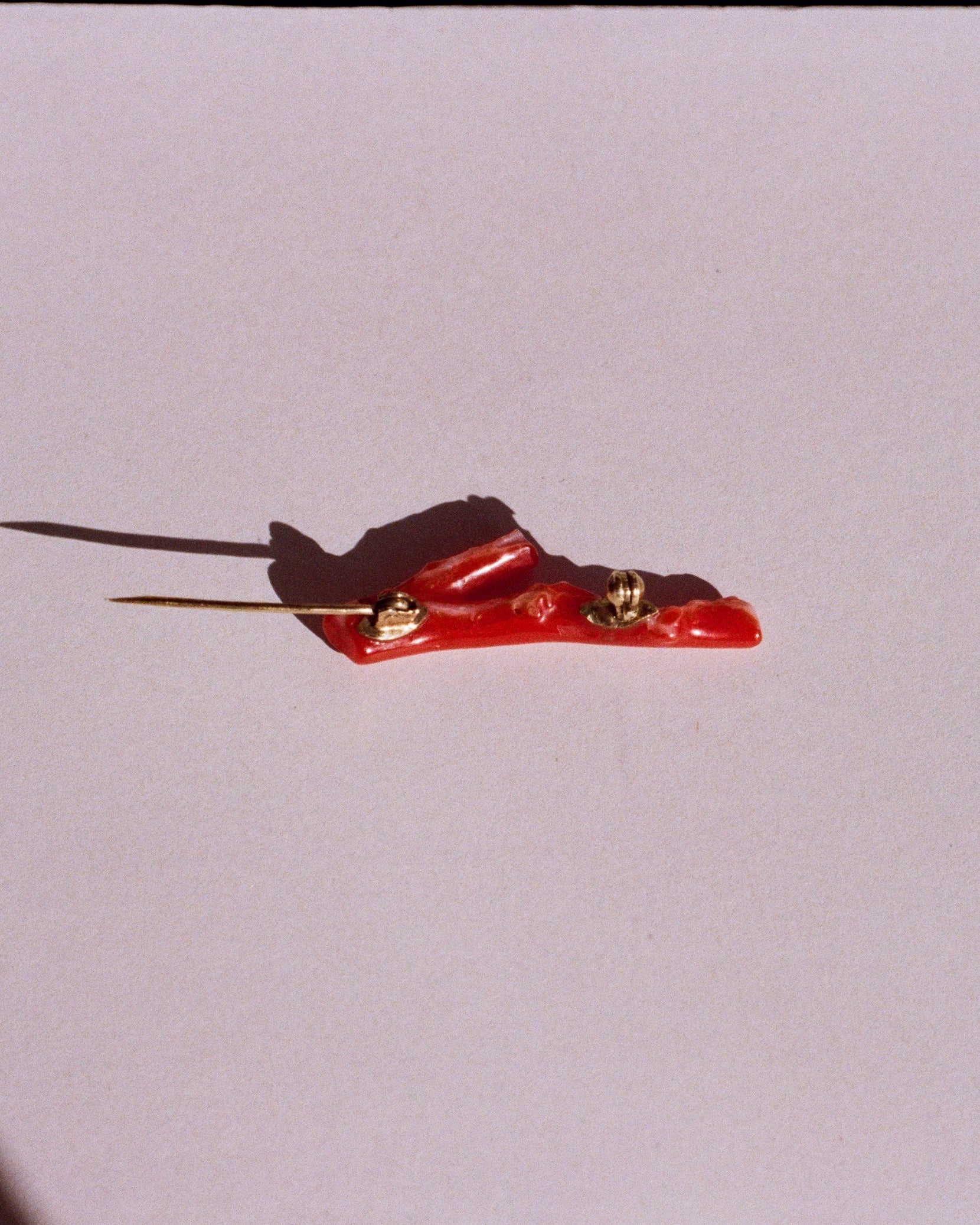 coral and gold brooch