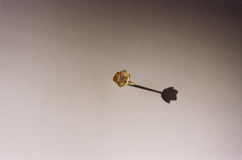 a diamond poppy ring