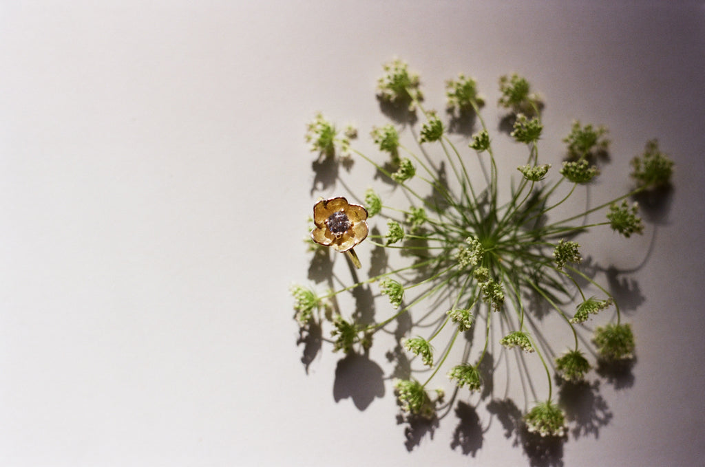 a diamond poppy ring